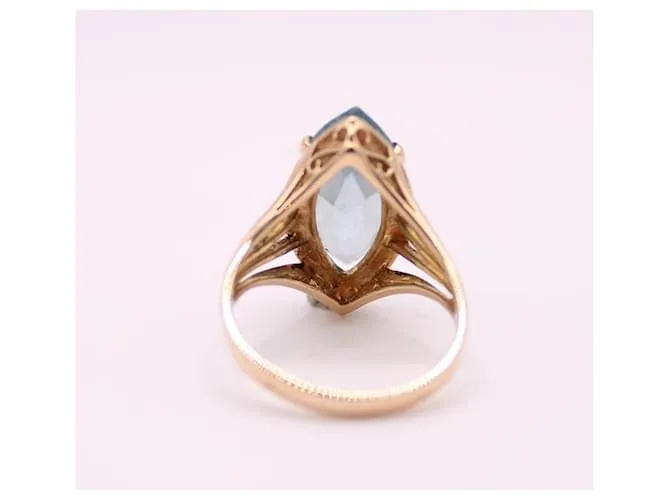Autre Marque Anillo estilo marquesa engastado con una aguamarina en oro amarillo 750%O Azul claro Gold hardware 