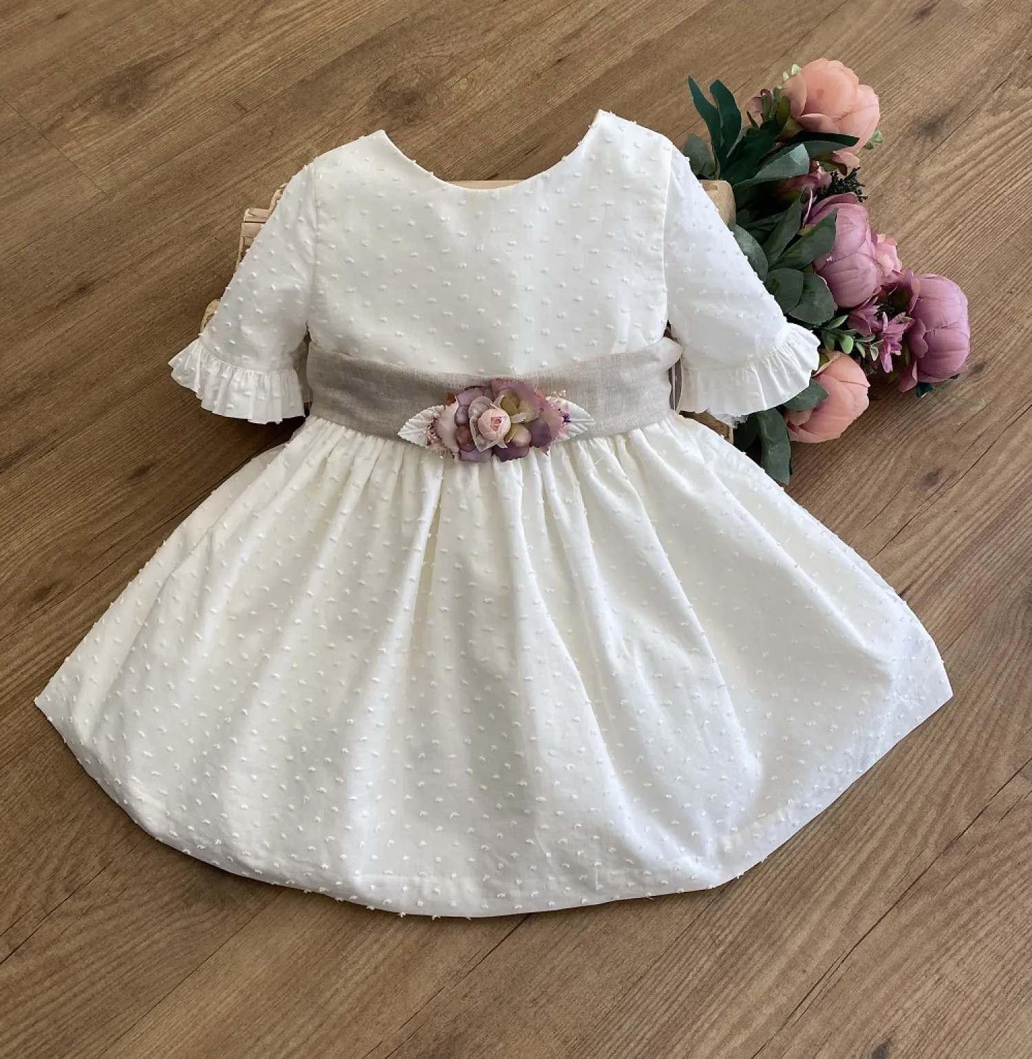 Ecru plumeti flower dress with sand linen bow.