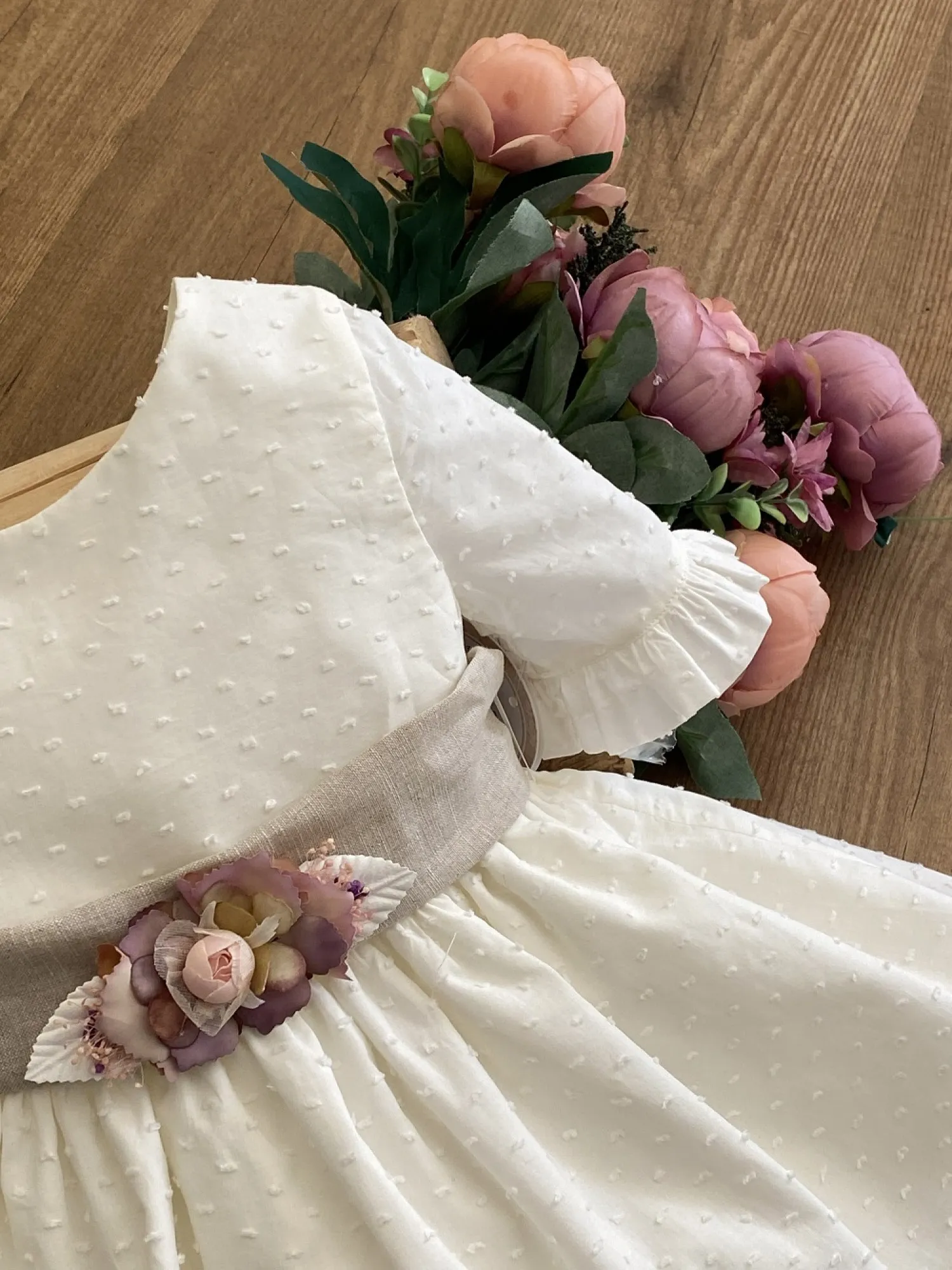 Ecru plumeti flower dress with sand linen bow.