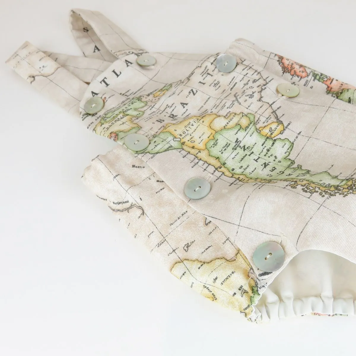 Ranita – Pelele mapa mundi beige